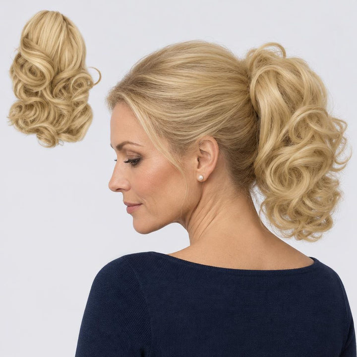 Tangled Ponyo in Warm Blonde – curly clip-in ponytail extension, shown loose and worn by a model